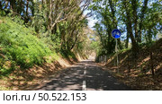 Point of view shot of riding a bicycle in Sever do Vouga, Portugal. Features a wide view of the bike track and the natural scenery. Стоковое фото, агентство Ingram Publishing / Фотобанк Лори