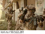 Professional marine soldiers training with weapon on a military range. Стоковое фото, агентство Ingram Publishing / Фотобанк Лори