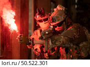 Soldier in anti-terrorist warfare in a dark building, Anti-terrorist operation training on the battlefield. Стоковое фото, агентство Ingram Publishing / Фотобанк Лори
