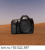 dslr camera on desert. Стоковое фото, агентство Ingram Publishing / Фотобанк Лори