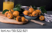 loquats on kitchen counter background. Стоковое фото, агентство Ingram Publishing / Фотобанк Лори