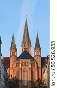 The three steeple of the Church of St Paul in Schwerin on a sunny day. Стоковое фото, фотограф Аnna Ivanova / Фотобанк Лори
