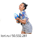 Portrait lovely woman in floral shirt and short jeans holding water gun and loudspeaker, smile and enjoy with music on white background, Songkran festival, Thailand culture with Thai’s new year’s day. Стоковое фото, агентство Ingram Publishing / Фотобанк Лори