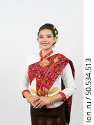 Portrait asian pretty woman posing to pay respect with smiling in Thai northeastern dress costume,  Welcome expression Sawasdee on white background. Стоковое фото, агентство Ingram Publishing / Фотобанк Лори