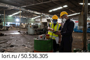 Scientists and government officials Inspect and collect chemical leak samples in industrial sites. to be thoroughly investigated in the laboratory. Стоковое фото, агентство Ingram Publishing / Фотобанк Лори