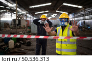 Restricted area, officials employ white and red stripes to block the area where a chemical leak is occurring. To prevent individuals from coming into contact with potentially dangerous chemicals, Стоковое фото, агентство Ingram Publishing / Фотобанк Лори