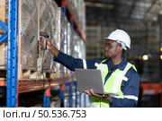 Working in a large industrial facility with heavy materials and machinery. Safety considerations are therefore of the utmost significance. Extreme vigilance must be exercised in this situation. Стоковое фото, агентство Ingram Publishing / Фотобанк Лори