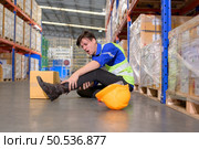 Working in a large industrial facility with heavy materials and machinery. Safety considerations are therefore of the utmost significance. Extreme vigilance must be exercised in this situation. Стоковое фото, агентство Ingram Publishing / Фотобанк Лори