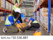 Working in a large industrial facility with heavy materials and machinery. Safety considerations are therefore of the utmost significance. Extreme vigilance must be exercised in this situation. Стоковое фото, агентство Ingram Publishing / Фотобанк Лори