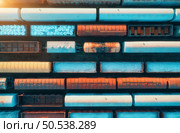 Aerial view of freight trains at sunset. Railway cargo wagons with goods on railroad. Top view of colorful wagons. Depot of freight trains. Railway station. Heavy industry. Industrial. Transportation. Стоковое фото, агентство Ingram Publishing / Фотобанк Лори