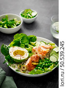 Salmon avocado bowl with broccoli, green peas, rice and fresh salad. Healthy food, top view. Стоковое фото, агентство Ingram Publishing / Фотобанк Лори