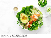 Salmon avocado bowl with broccoli, green peas, rice and fresh salad. Healthy food, top view. Стоковое фото, агентство Ingram Publishing / Фотобанк Лори