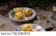 Typical portuguese snack with meat. Chicken pies know as empadas de frango or galinha on old fashioned ceramic plates. Стоковое фото, агентство Ingram Publishing / Фотобанк Лори