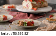 Meringue roll cake with cream, raspberries. Roulade, summer dessert served in ceramic plate. Стоковое фото, агентство Ingram Publishing / Фотобанк Лори