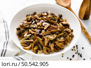 Champignon mushrooms sauteed with onion. Стоковое фото, агентство Ingram Publishing / Фотобанк Лори