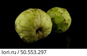 Fresh Custard Apple isolated on black background. Стоковое фото, агентство Ingram Publishing / Фотобанк Лори