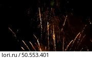 Multiple fireworks explosions on a dark night sky. Стоковое фото, агентство Ingram Publishing / Фотобанк Лори