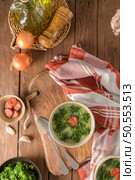 Caldo verde popular soup in Portuguese cuisine. traditional ingredients for caldo verde are potatoes, collard greens , olive oil and salt. Additionally garlic or onion may be added. Стоковое фото, агентство Ingram Publishing / Фотобанк Лори