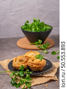 Pastries filled with meat, traditionally baked in black clay molds both from the region on Vila Real, Portugal. Стоковое фото, агентство Ingram Publishing / Фотобанк Лори