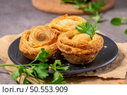 Pastries filled with meat, traditionally baked in black clay molds both from the region on Vila Real, Portugal. Стоковое фото, агентство Ingram Publishing / Фотобанк Лори