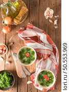 Caldo verde popular soup in Portuguese cuisine. traditional ingredients for caldo verde are potatoes, collard greens , olive oil and salt. Additionally garlic or onion may be added. Стоковое фото, агентство Ingram Publishing / Фотобанк Лори