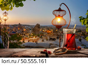 View of Cappadocia and a cup of Turkish tea. Tea drinking in Cappadocia. Стоковое фото, агентство Ingram Publishing / Фотобанк Лори