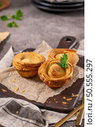 Pastries filled with meat, traditionally baked in black clay molds both from the region on Vila Real, Portugal. Стоковое фото, агентство Ingram Publishing / Фотобанк Лори