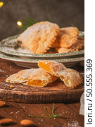 A crescent-shaped pastry whose filling is made of eggs and almonds wrapped in crispy dough, cut in an artisanal way and sprinkled with sugar. Стоковое фото, агентство Ingram Publishing / Фотобанк Лори