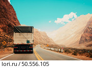 truck on the road and rocks in the background. Стоковое фото, агентство Ingram Publishing / Фотобанк Лори