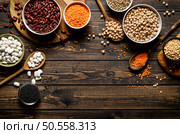 Various types of legumes, beans, lentils, chickpeas and peas, top view. Стоковое фото, агентство Ingram Publishing / Фотобанк Лори