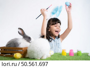 Easter bunny fun with little children the beauty of friendship between humans and animals. Стоковое фото, агентство Ingram Publishing / Фотобанк Лори