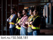 Portrait of group employees in the warehouse with arms crossed. Стоковое фото, агентство Ingram Publishing / Фотобанк Лори