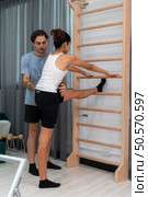A young man and a young woman are doing cool down after pilates exercises class. Стоковое фото, агентство Ingram Publishing / Фотобанк Лори