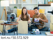 Young couples and a small firm are selling things online via social media channels. Стоковое фото, агентство Ingram Publishing / Фотобанк Лори