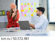Multiethnic young business people working together in modern office, Collaborate to designing an application for use on the internet network. Стоковое фото, агентство Ingram Publishing / Фотобанк Лори