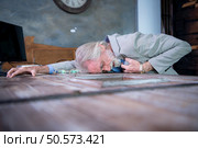 An elderly businessman suffered a sudden heart failure at work. Стоковое фото, агентство Ingram Publishing / Фотобанк Лори