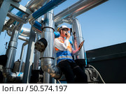Engineers inspect the completed air conditioning and water systems to continue verifying their functionality. Стоковое фото, агентство Ingram Publishing / Фотобанк Лори