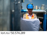 Engineers inspect the completed air conditioning and water systems to continue verifying their functionality. Стоковое фото, агентство Ingram Publishing / Фотобанк Лори