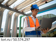 Engineers inspect the completed air conditioning and water systems to continue verifying their functionality. Стоковое фото, агентство Ingram Publishing / Фотобанк Лори