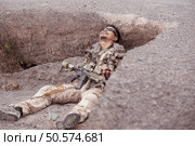 Soldiers in camouflage military uniforms carrying weapons, Reconnaissance missions in rugged mountains, Assault infantry battle training. Стоковое фото, агентство Ingram Publishing / Фотобанк Лори