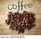 coffee beans on wood background. Стоковое фото, агентство Ingram Publishing / Фотобанк Лори