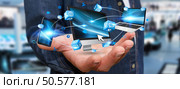 Businessman connecting tech devices computer phone and tablet. Стоковое фото, агентство Ingram Publishing / Фотобанк Лори
