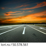 Country road with a dark sky. Стоковое фото, агентство Ingram Publishing / Фотобанк Лори