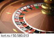 Playing roulette in the casino. Depth of field in the ball. Стоковое фото, агентство Ingram Publishing / Фотобанк Лори