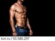 Muscular and sexy torso of young man with perfect abs. Muscular and sexy torso of young man in jeans. Стоковое фото, агентство Ingram Publishing / Фотобанк Лори