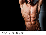 Muscular and sexy torso of young man with perfect abs. Athletic body of young hunk. Fitness concept.. Muscular and sexy torso of young man having perfect abs. Male hunk with athletic body. Fitness concept. Стоковое фото, агентство Ingram Publishing / Фотобанк Лори