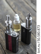 Advanced personal vaporizer or e-cigarette, from above. Стоковое фото, агентство Ingram Publishing / Фотобанк Лори
