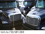 A group of parked semi tractors. Стоковое фото, агентство Ingram Publishing / Фотобанк Лори