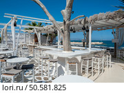 Restaurant on the beach in Naxos, Greece. Стоковое фото, агентство Ingram Publishing / Фотобанк Лори