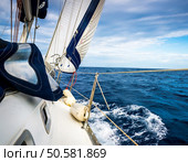 The white sails of yachts on the background of sea and sky in the clouds. Стоковое фото, агентство Ingram Publishing / Фотобанк Лори